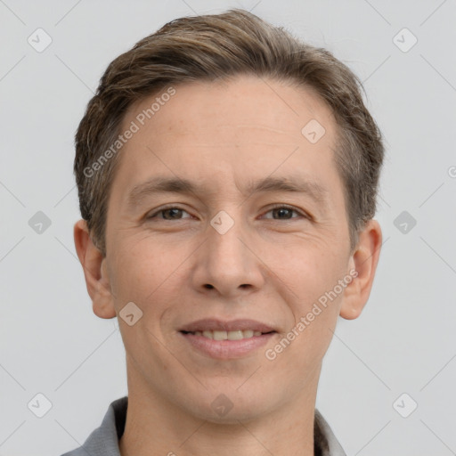 Joyful white adult male with short  brown hair and grey eyes