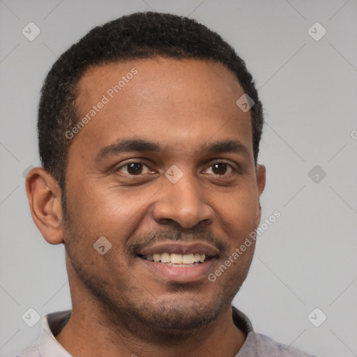 Joyful latino young-adult male with short  brown hair and brown eyes