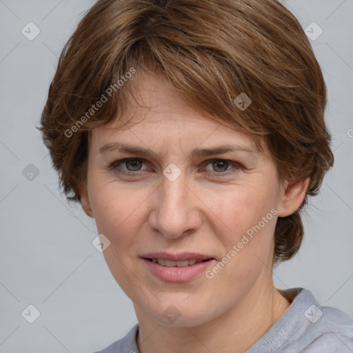 Joyful white adult female with medium  brown hair and grey eyes