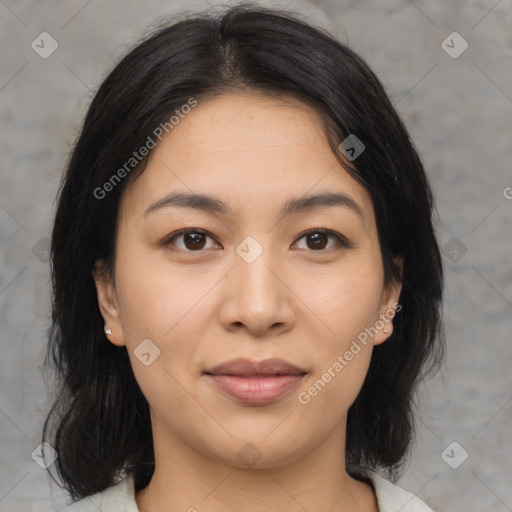 Joyful asian young-adult female with medium  black hair and brown eyes