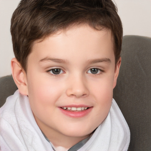 Joyful white child male with short  brown hair and brown eyes