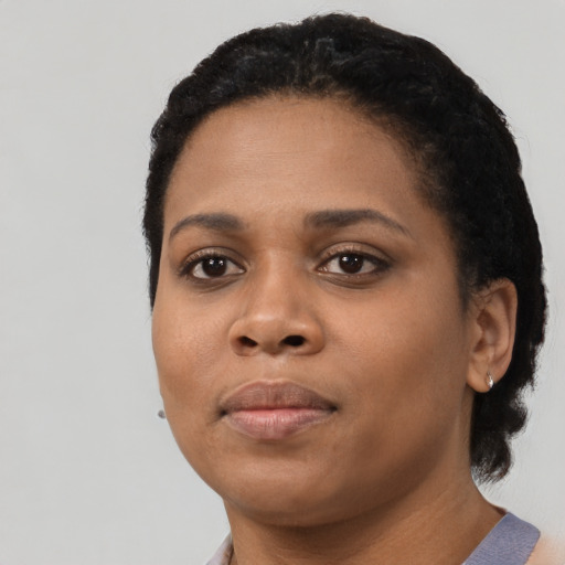 Neutral black young-adult female with short  black hair and brown eyes