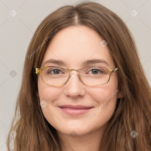 Joyful white young-adult female with long  brown hair and green eyes