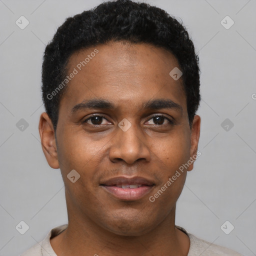 Joyful black young-adult male with short  black hair and brown eyes