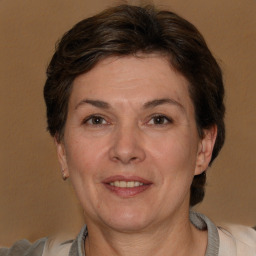 Joyful white adult female with short  brown hair and brown eyes