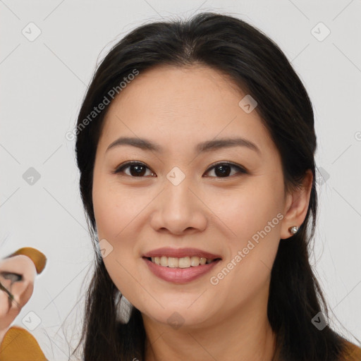 Joyful white young-adult female with long  brown hair and brown eyes