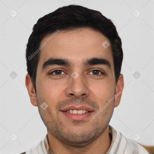 Joyful white young-adult male with short  black hair and brown eyes