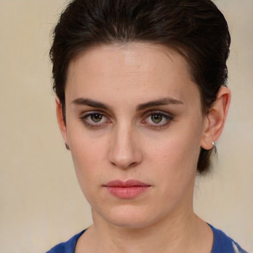 Neutral white young-adult female with short  brown hair and brown eyes