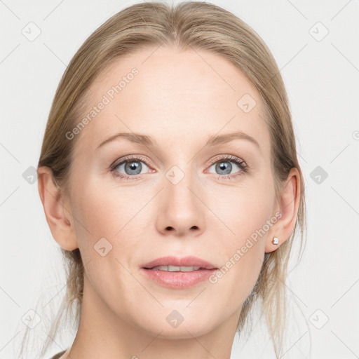 Joyful white young-adult female with medium  brown hair and blue eyes