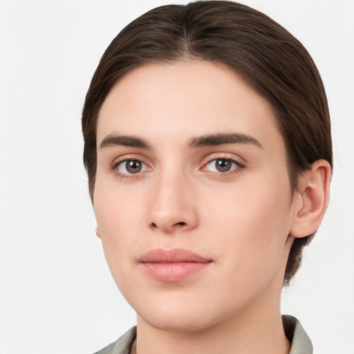 Neutral white young-adult female with short  brown hair and brown eyes