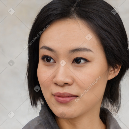 Joyful asian young-adult female with medium  black hair and brown eyes