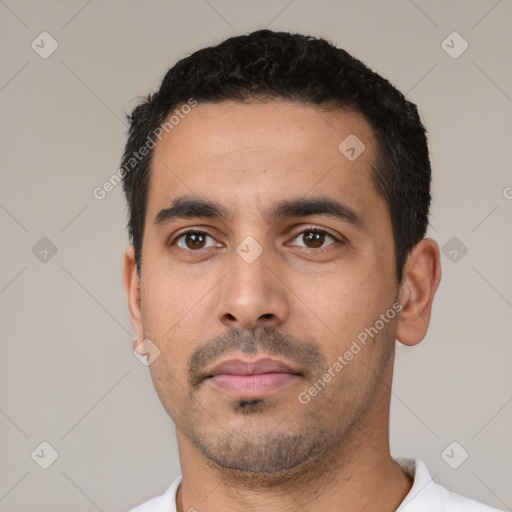 Neutral latino young-adult male with short  black hair and brown eyes