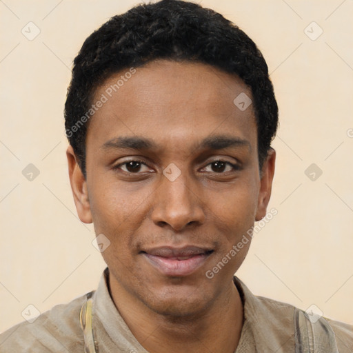 Joyful black young-adult male with short  black hair and brown eyes