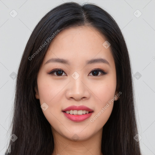 Joyful asian young-adult female with long  brown hair and brown eyes