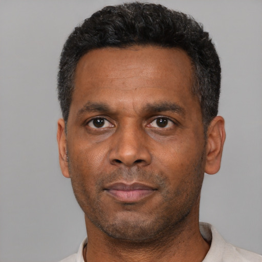 Neutral black adult male with short  brown hair and brown eyes