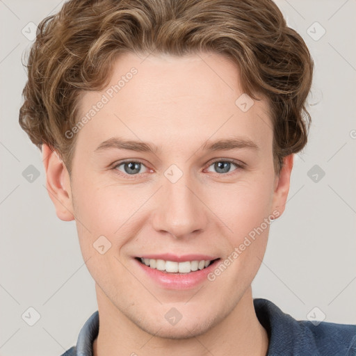 Joyful white young-adult male with short  brown hair and blue eyes