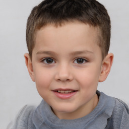 Joyful white child male with short  brown hair and brown eyes