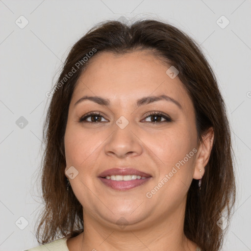Joyful white adult female with medium  brown hair and brown eyes
