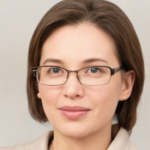 Joyful white young-adult female with medium  brown hair and grey eyes