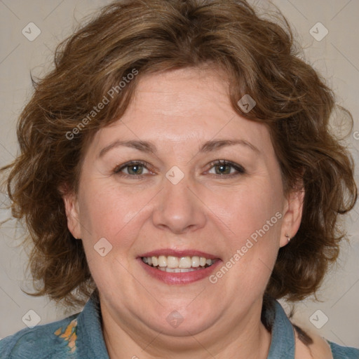 Joyful white adult female with medium  brown hair and blue eyes