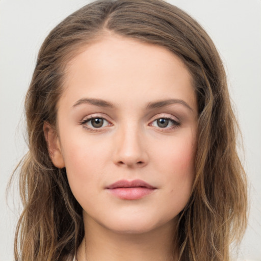 Neutral white young-adult female with long  brown hair and brown eyes