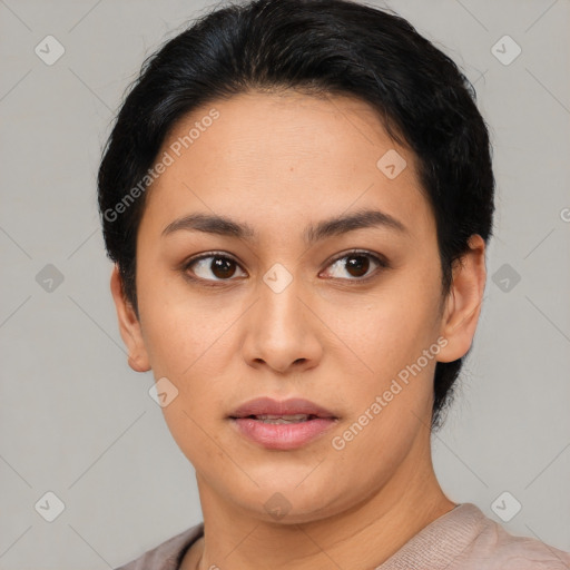 Joyful latino young-adult female with short  black hair and brown eyes