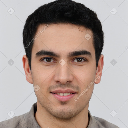 Joyful white young-adult male with short  black hair and brown eyes