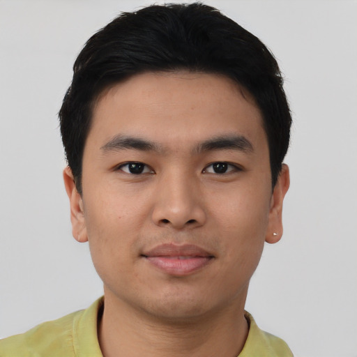 Joyful asian young-adult male with short  black hair and brown eyes