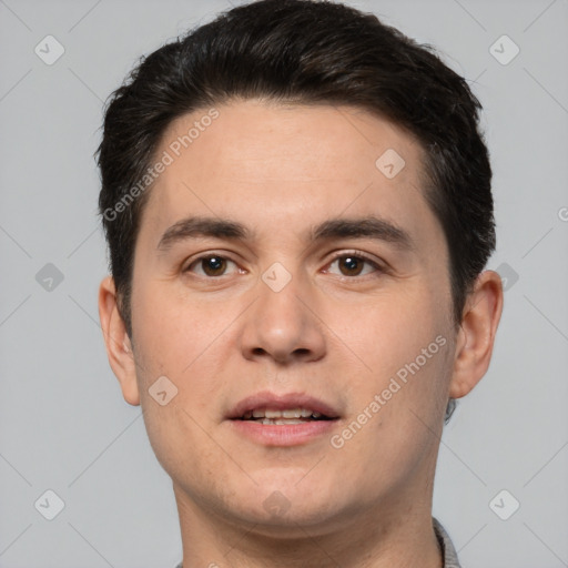 Joyful white young-adult male with short  brown hair and brown eyes