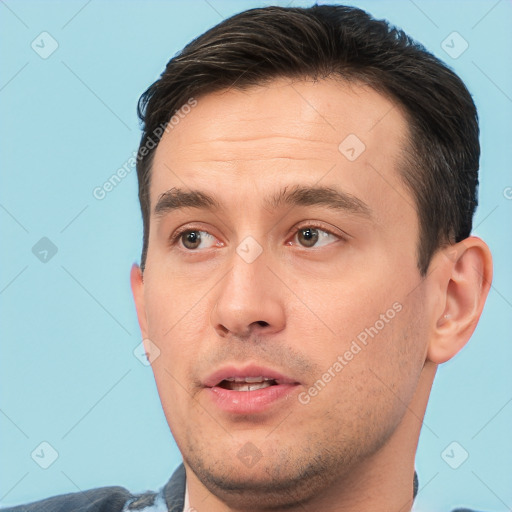 Joyful white adult male with short  brown hair and brown eyes