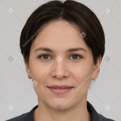 Joyful white young-adult female with short  brown hair and brown eyes