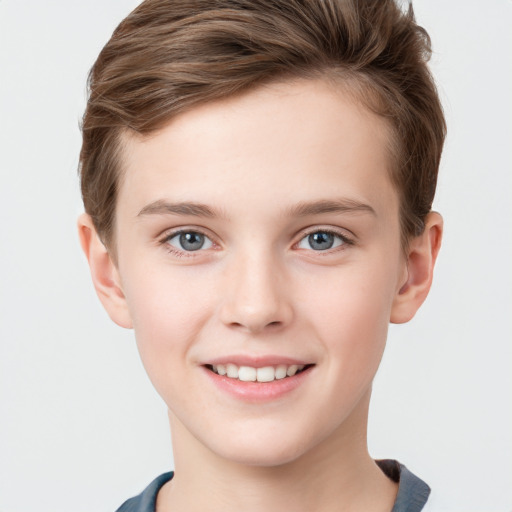 Joyful white child male with short  brown hair and grey eyes