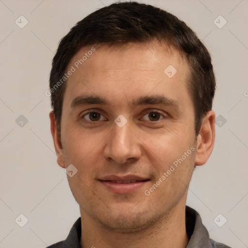 Joyful white adult male with short  brown hair and brown eyes