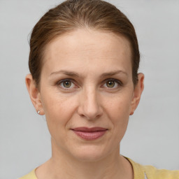 Joyful white adult female with short  brown hair and grey eyes