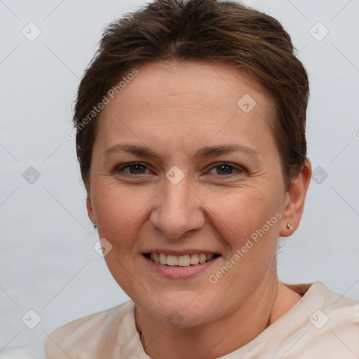 Joyful white adult female with short  brown hair and brown eyes