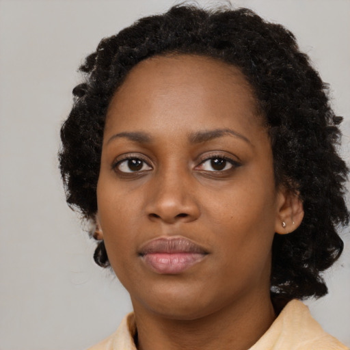 Neutral black young-adult female with medium  black hair and brown eyes