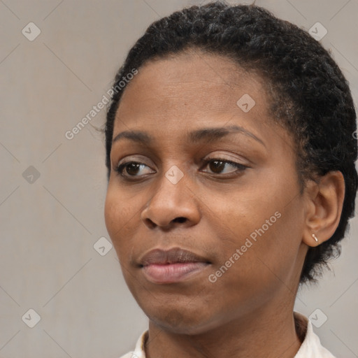 Neutral black young-adult female with short  brown hair and brown eyes