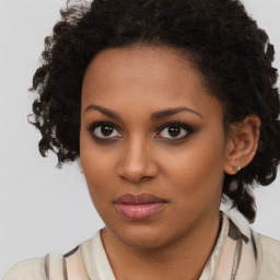 Joyful black young-adult female with medium  brown hair and brown eyes