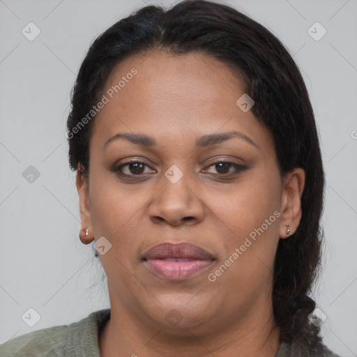 Joyful black adult female with medium  brown hair and brown eyes