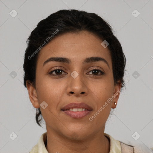 Joyful latino young-adult female with short  brown hair and brown eyes