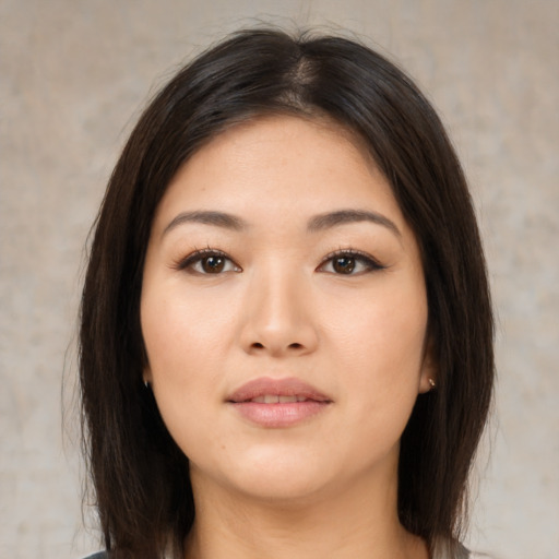 Neutral asian young-adult female with medium  brown hair and brown eyes