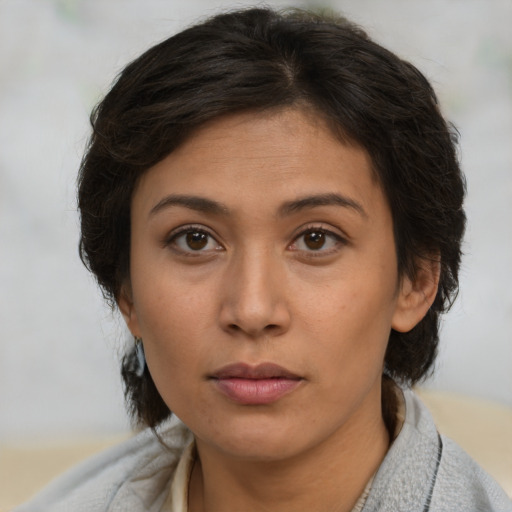 Neutral latino young-adult female with short  brown hair and brown eyes