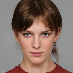 Neutral white young-adult female with medium  brown hair and grey eyes