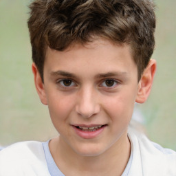 Joyful white child male with short  brown hair and brown eyes