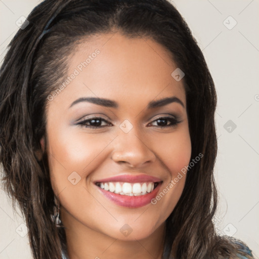 Joyful latino young-adult female with long  brown hair and brown eyes