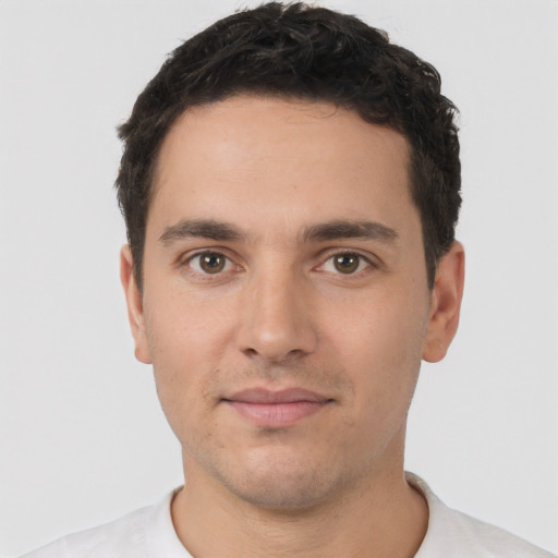 Neutral white young-adult male with short  black hair and brown eyes