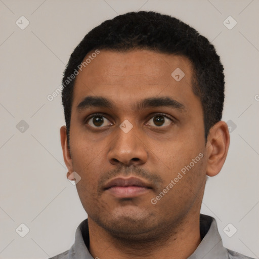 Neutral black young-adult male with short  black hair and brown eyes