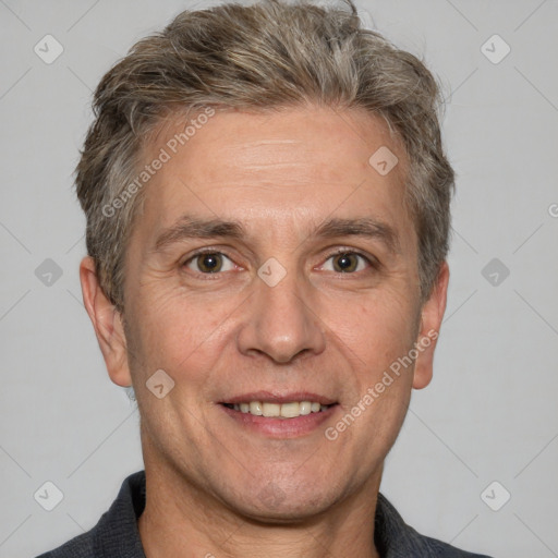 Joyful white adult male with short  brown hair and grey eyes