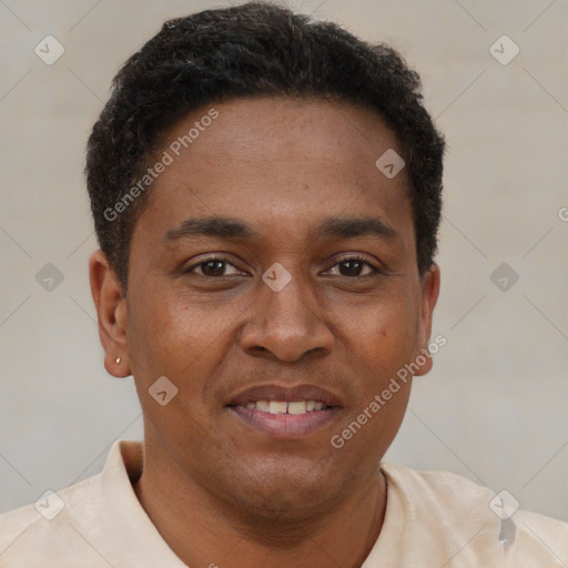 Joyful black young-adult male with short  brown hair and brown eyes