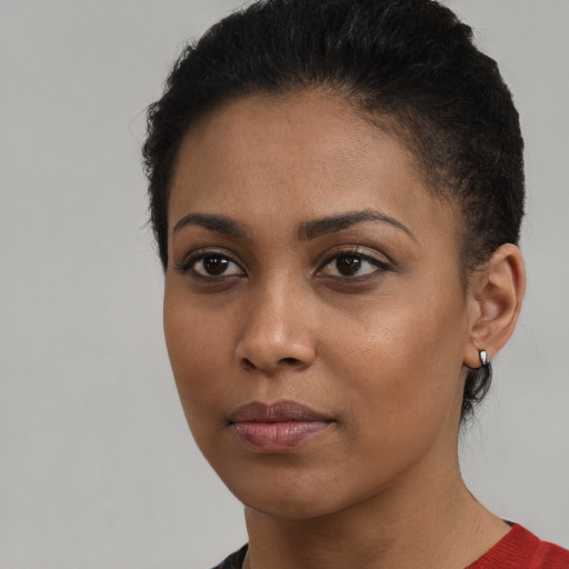 Neutral black young-adult female with short  brown hair and brown eyes